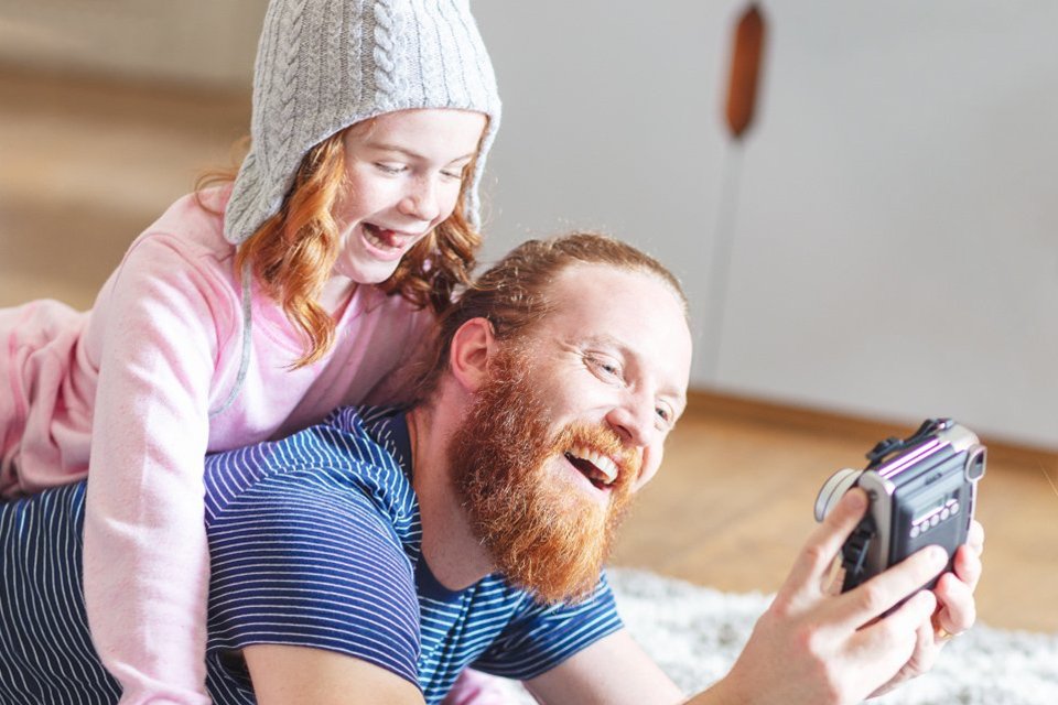 Family n phone laughing.